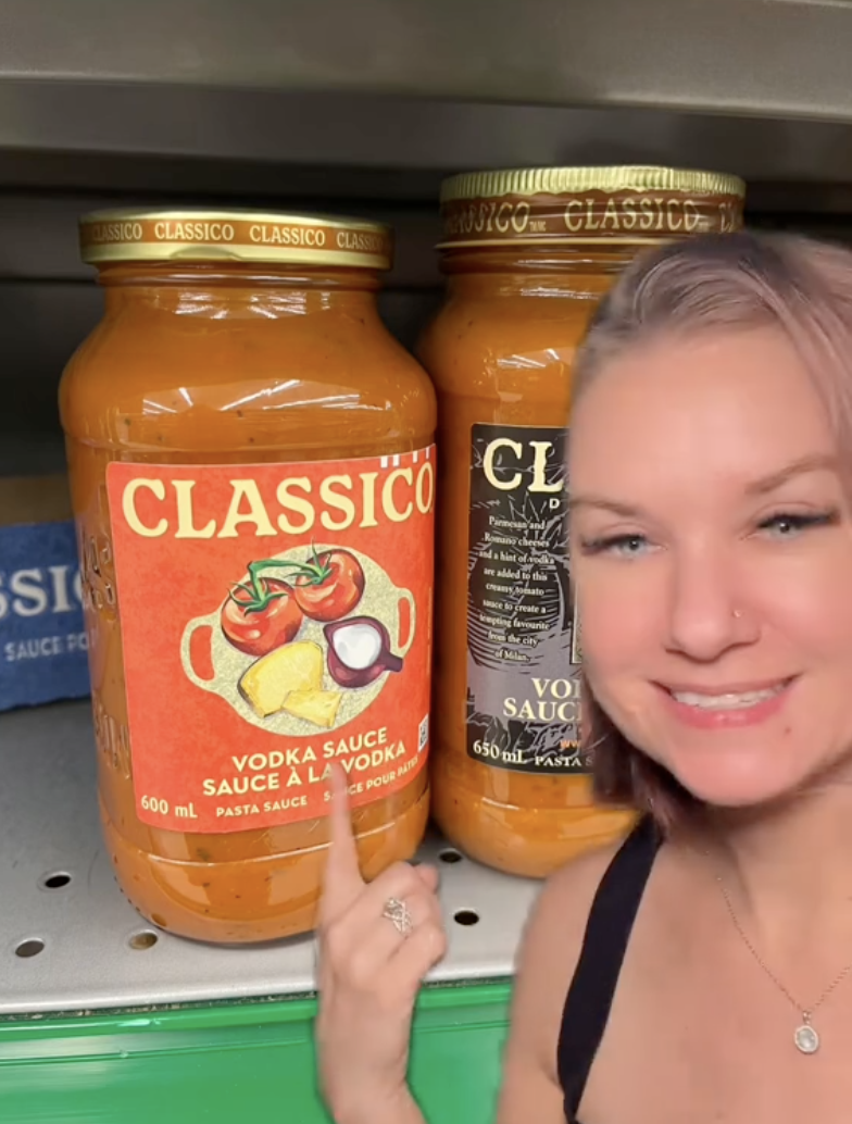 woman with bottles of spaghetti sauce